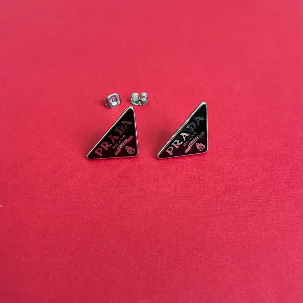 Prada logo triangle stud earrings